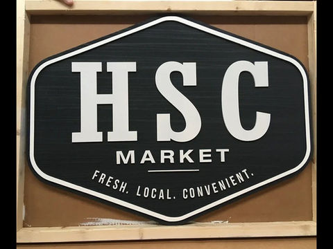 Custom signs for business being manufactured