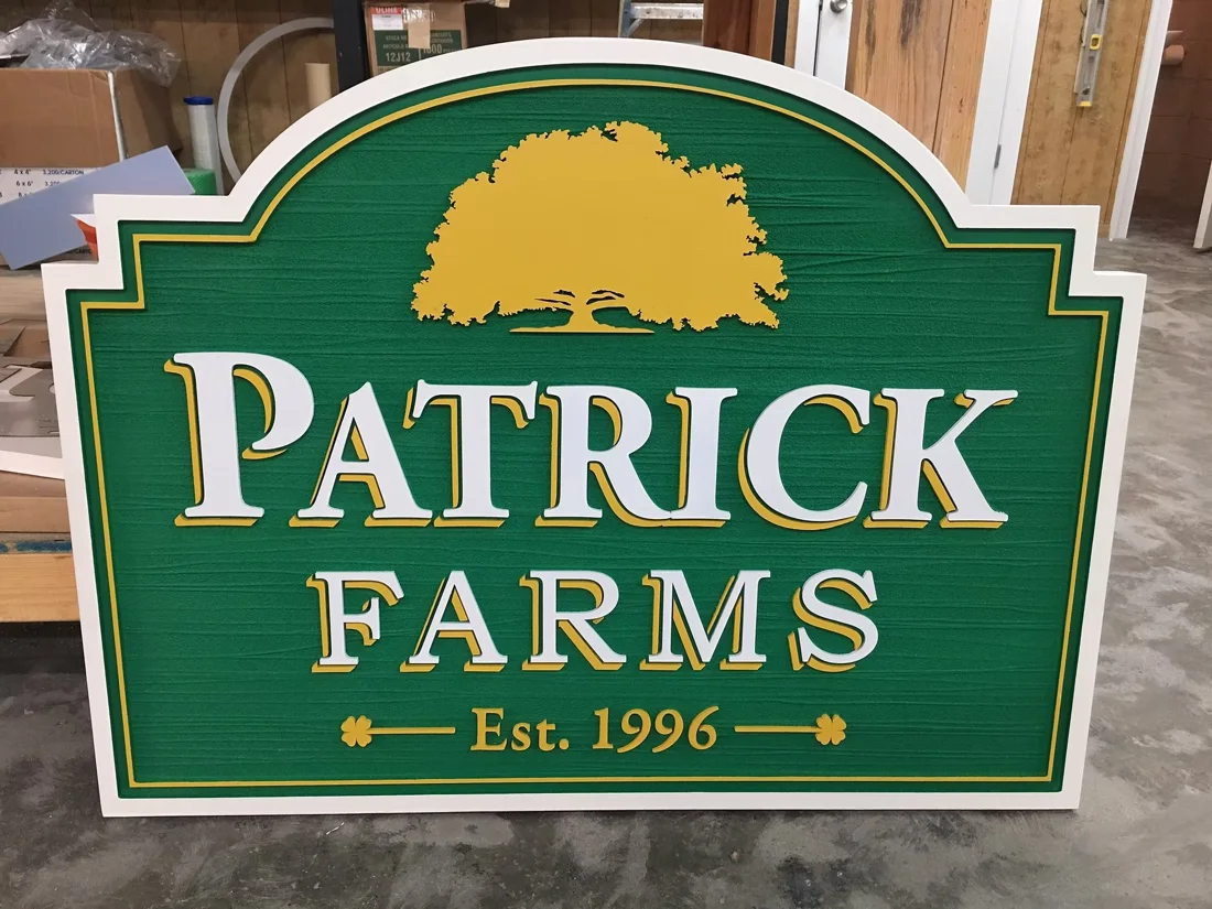 Patrick Farms — routed woodgrain HDU sign with raised lettering.