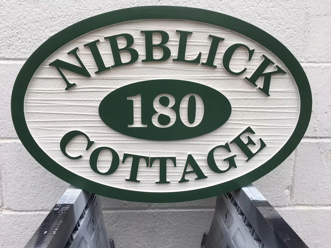Project 95: Nibblick Cottage — oval dimensional property sign.