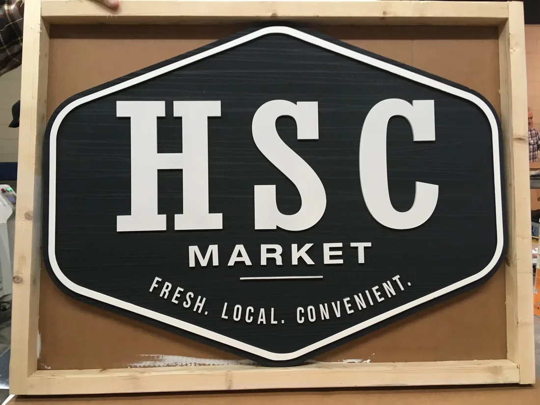 HSC Market — layered dimensional sign with raised letters.