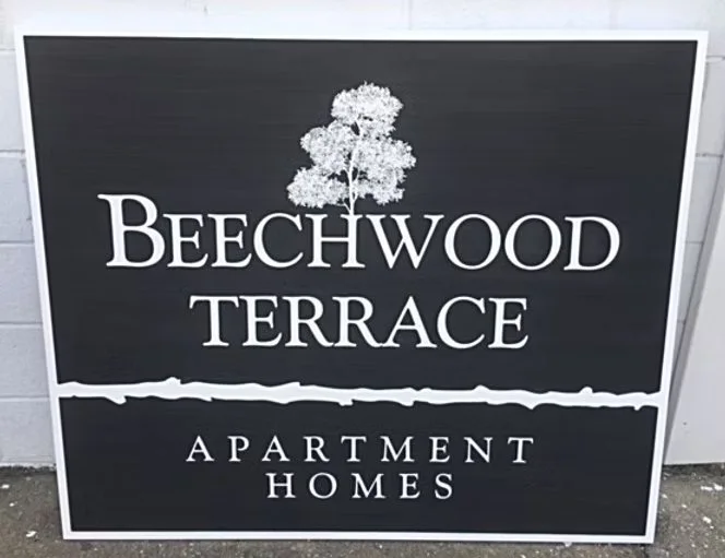 Beechwood Terrace Apartment Homes — routed property sign.