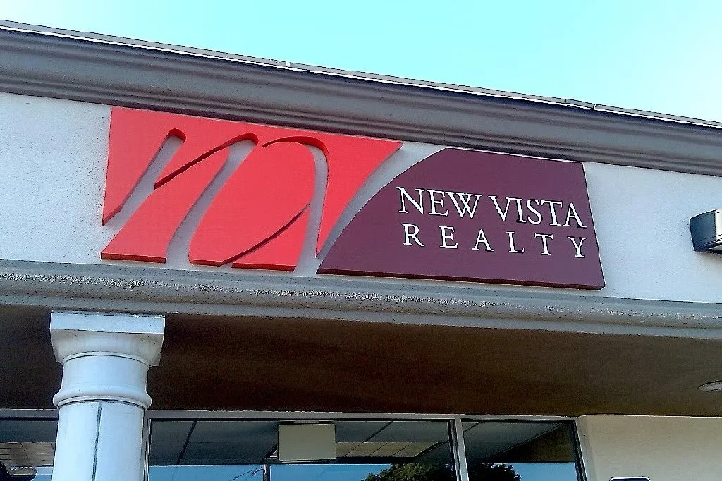 Project 39: New Vista Realty — dimensional exterior building logo sign.