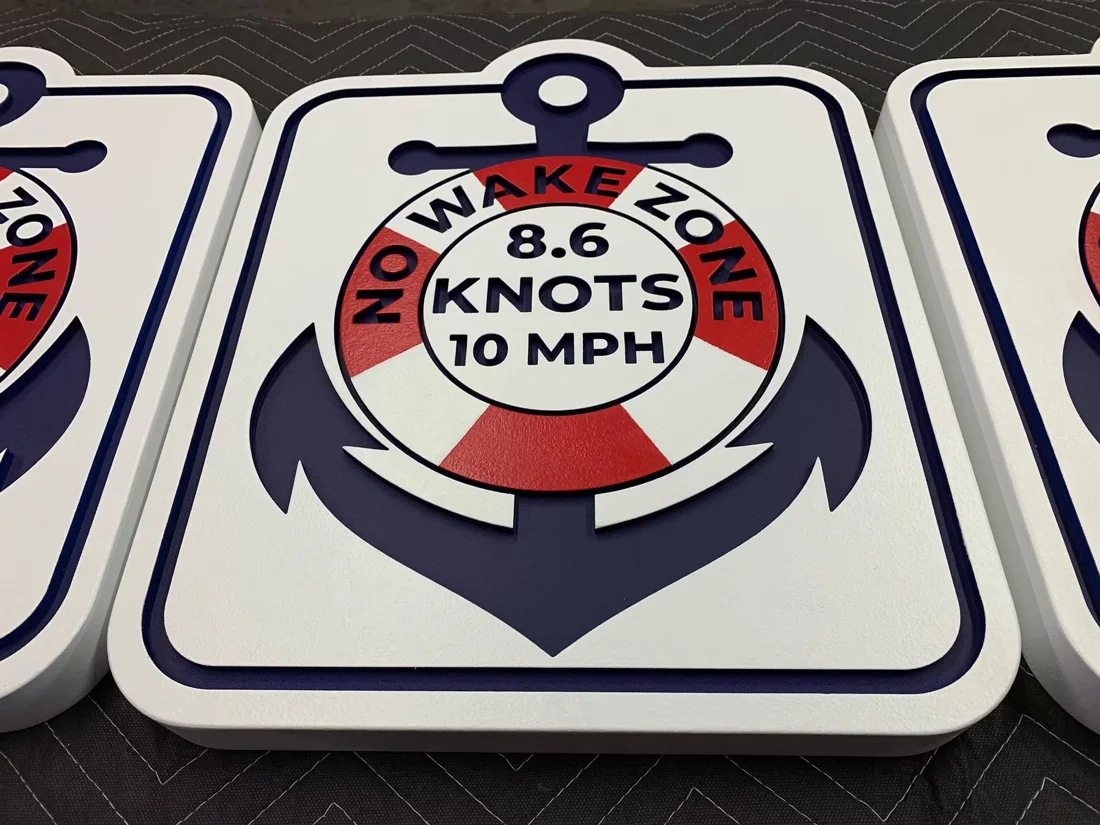 Matching No Wake Zone marina signs with dimensional anchor graphics