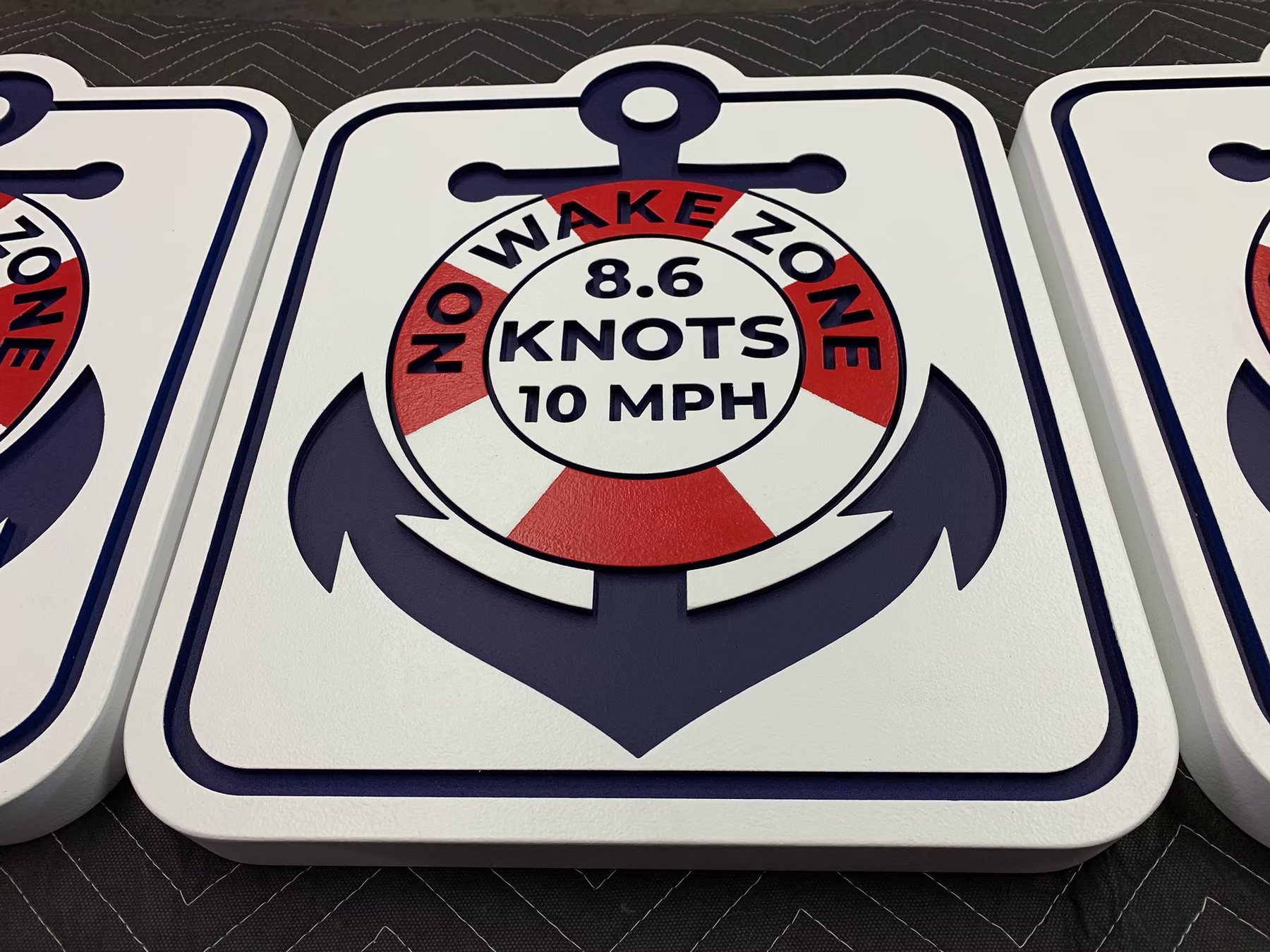 Matching No Wake Zone marina signs with dimensional anchor graphics