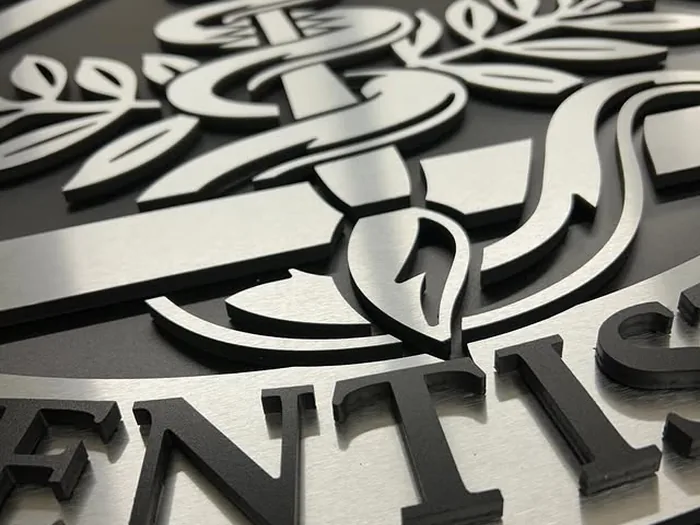 Black and white layered logo components with dimensional detail