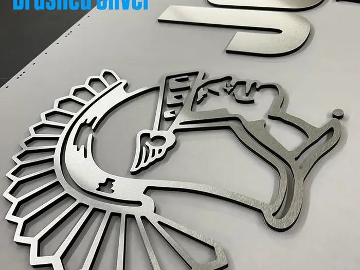 Brushed silver layered mascot logo and dimensional lettering
