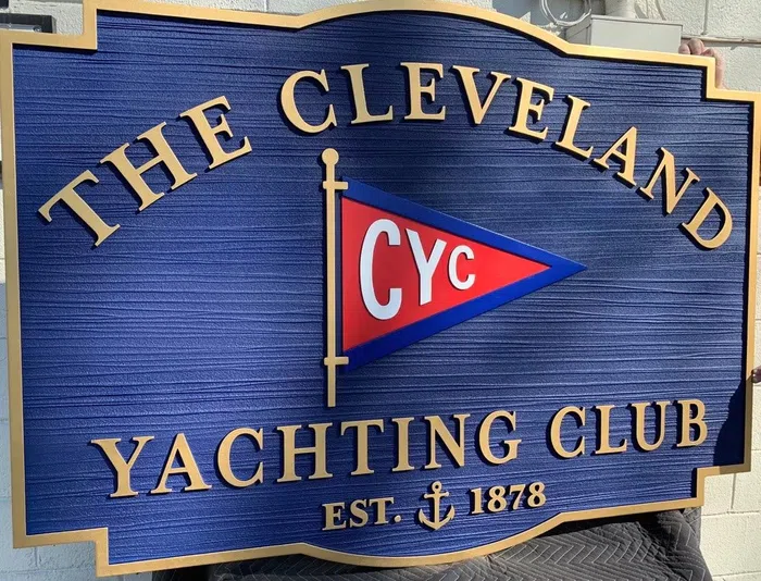 Blue and gold Cleveland Yachting Club carved-style sign