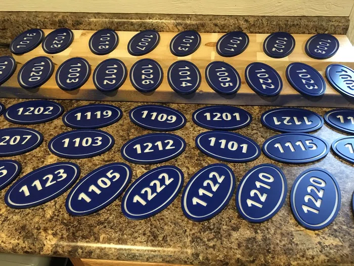 Blue oval address number plaques
