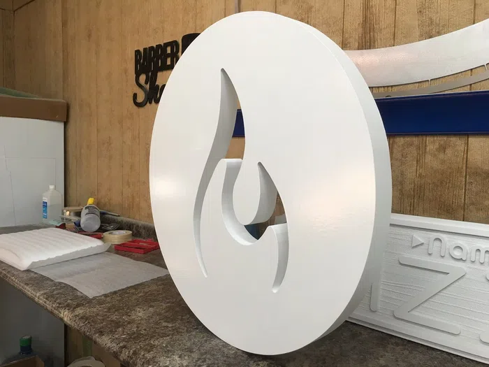 White custom routed round logo sign