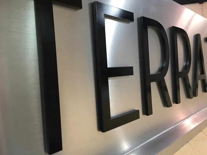 Black dimensional office wall letters installed indoors