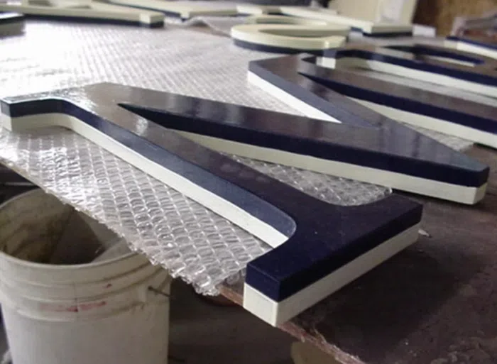 Close view of dimensional sign letters during production