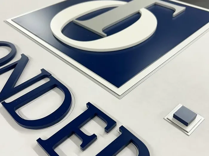 Blue and white painted acrylic layers with raised lettering