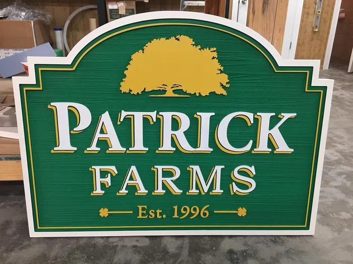 Green and gold Patrick Farms woodgrain HDU sign