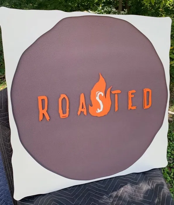 Round Roasted cafe logo sign with raised orange letters