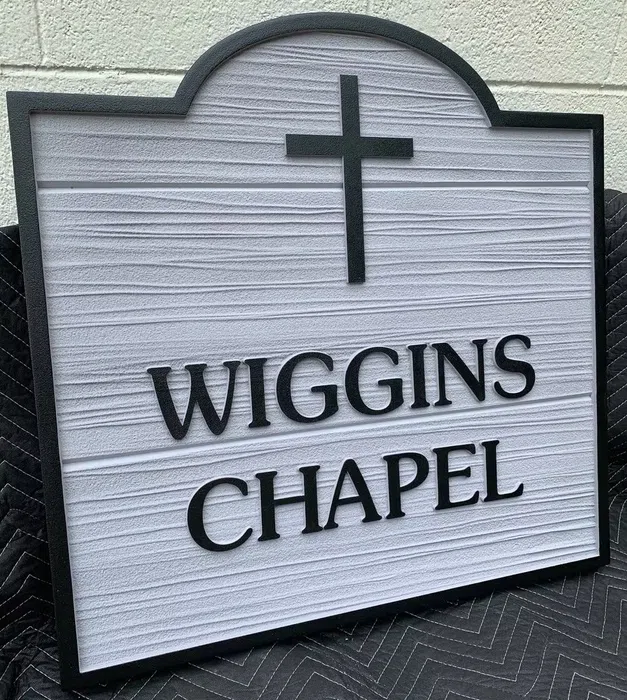 White and black Wiggins Chapel church sign
