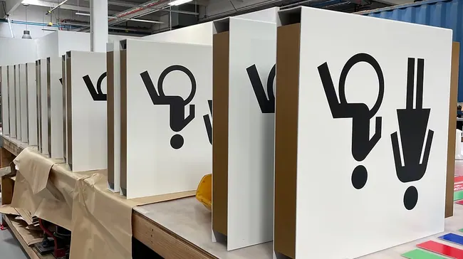 Custom restroom icon sign panels in production