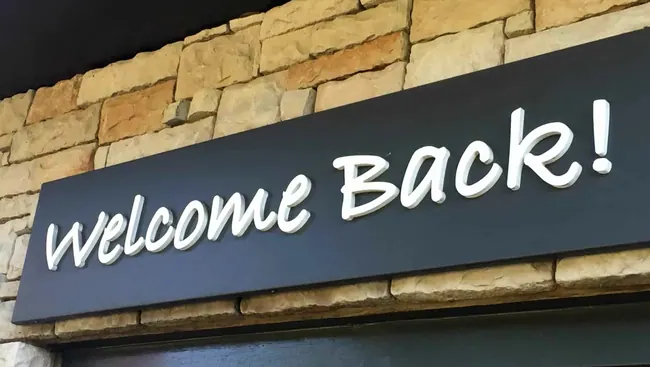 Welcome Back raised letters on an exterior sign